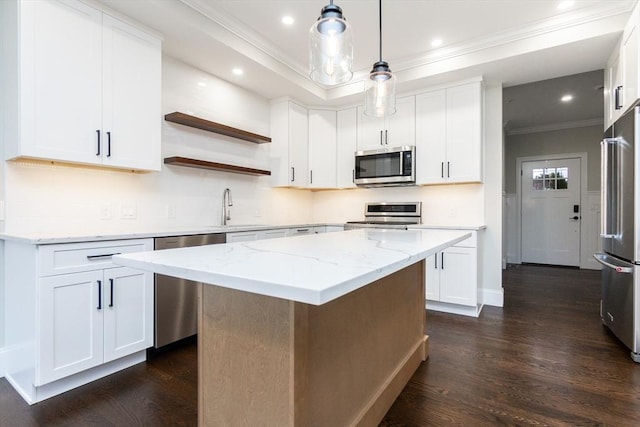 kitchen featuring dark hardwood / wood-style floors, white cabinetry, and appliances with stainless steel finishes