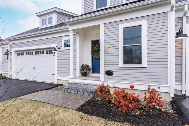 entrance to property featuring a garage