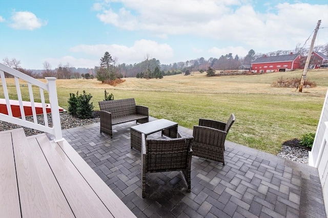 view of patio / terrace with a rural view