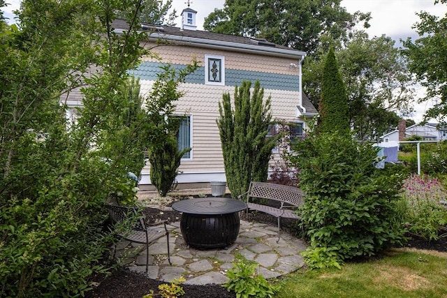 exterior space with a patio area and a fire pit