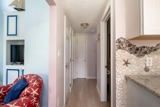 corridor featuring light hardwood / wood-style flooring