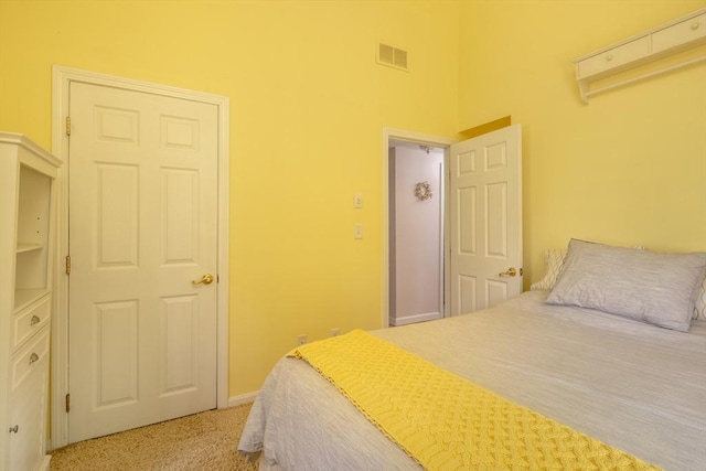 carpeted bedroom featuring a closet