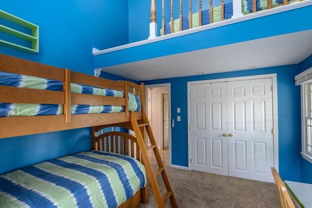 carpeted bedroom featuring a closet