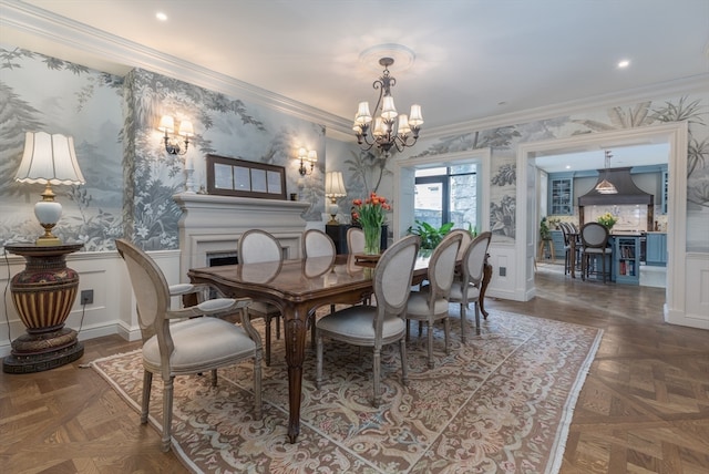 dining room featuring a chandelier, dark parquet flooring, and ornamental molding