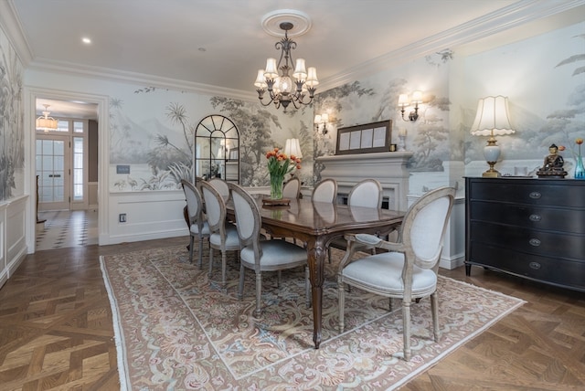 dining space with dark parquet floors, an inviting chandelier, and ornamental molding