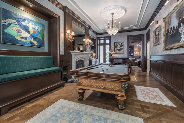 recreation room featuring an inviting chandelier, dark parquet floors, pool table, and ornamental molding