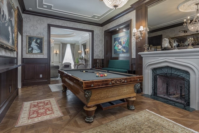 recreation room featuring crown molding, dark parquet floors, an inviting chandelier, and pool table