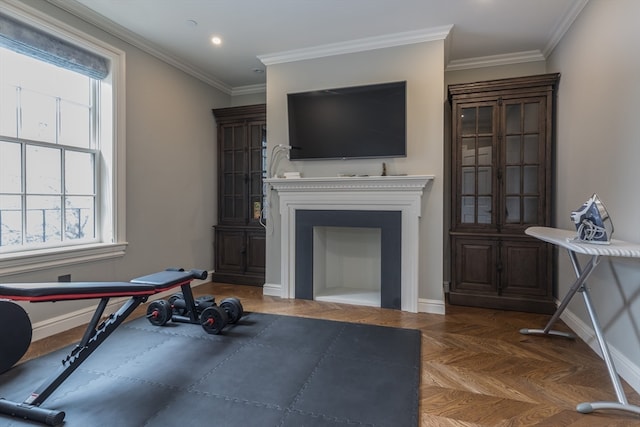 workout area featuring dark parquet flooring and crown molding