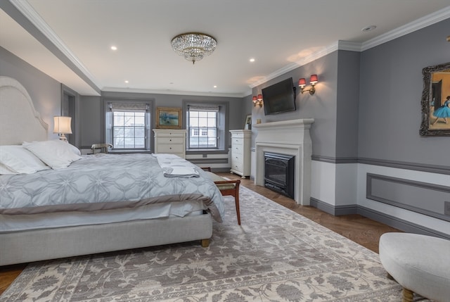 bedroom with a chandelier, dark parquet flooring, and ornamental molding