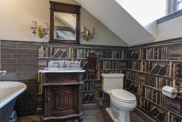 bathroom featuring backsplash, toilet, and large vanity