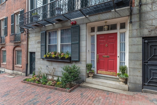 entrance to property featuring a balcony