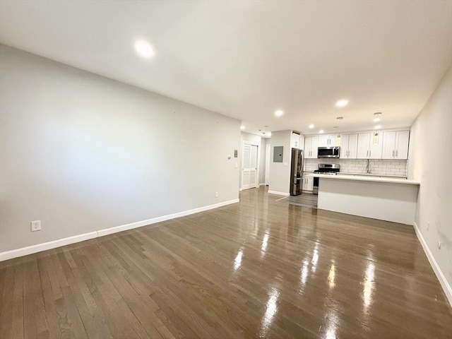 135 Granite Ave Unit 23, Boston, MA 02124 - unfurnished living room featuring baseboards, dark wood-style flooring, and recessed lighting