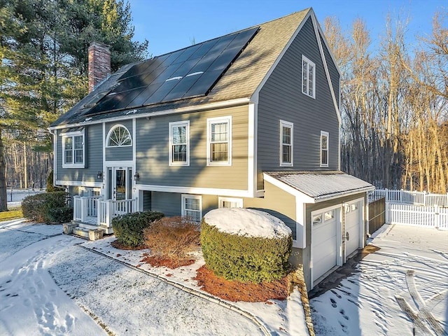 view of front of home featuring solar panels