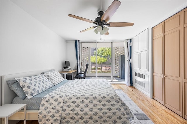 99 Pond Ave Unit 202, Brookline, MA 02445 - bedroom featuring floor to ceiling windows, access to exterior, light wood finished floors, and a ceiling fan