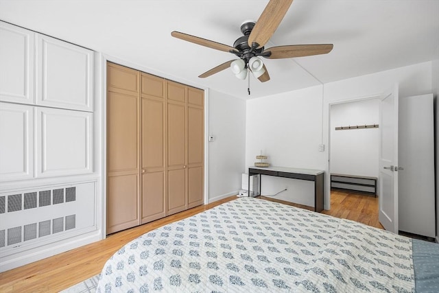 99 Pond Ave Unit 202, Brookline, MA 02445 - unfurnished bedroom featuring radiator heating unit, a closet, light wood-style flooring, baseboard heating, and ceiling fan