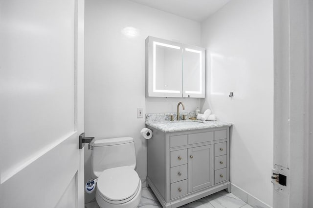 99 Pond Ave Unit 202, Brookline, MA 02445 - half bathroom with vanity and marble look tile flooring