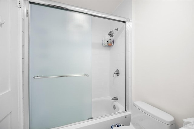 99 Pond Ave Unit 202, Brookline, MA 02445 - bathroom featuring toilet and bath / shower combo with glass door