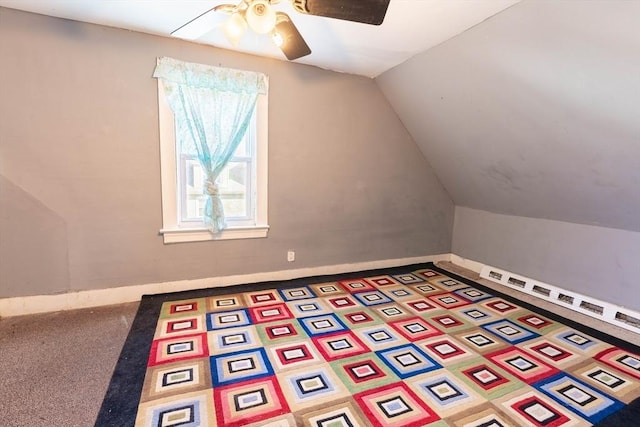 bonus room featuring vaulted ceiling, carpet flooring, and ceiling fan