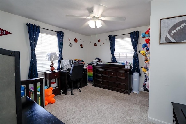 carpeted bedroom with ceiling fan and multiple windows