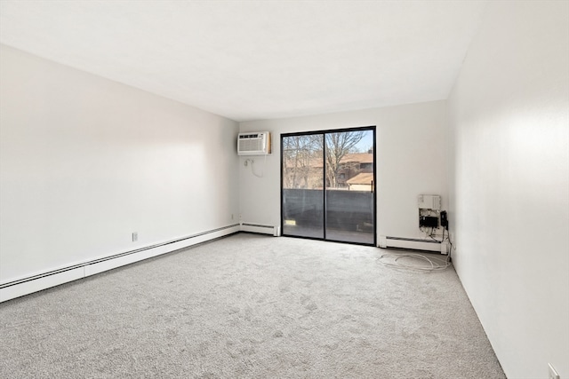 spare room featuring carpet, a wall unit AC, and a baseboard radiator