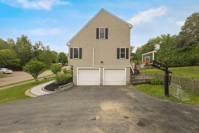1 Cherry Tree Ln, Plainville, MA 02762 - view of side of home with asphalt driveway and an attached garage