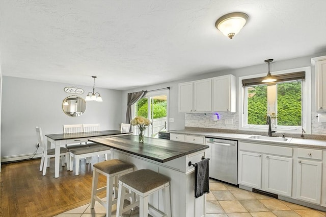 1 Cherry Tree Ln, Plainville, MA 02762 - kitchen with dishwasher, white cabinets, tasteful backsplash, and decorative light fixtures