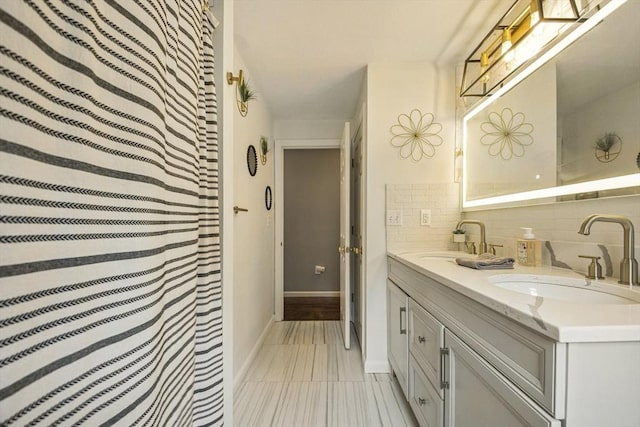 1 Cherry Tree Ln, Plainville, MA 02762 - full bath featuring double vanity and tasteful backsplash