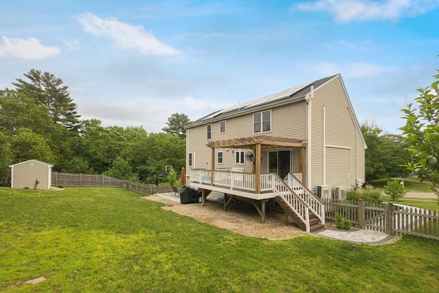 1 Cherry Tree Ln, Plainville, MA 02762 - rear view of house with a pergola, a fenced backyard, a wooden deck, and a storage shed
