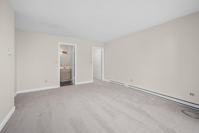 spare room with carpet floors and baseboard heating