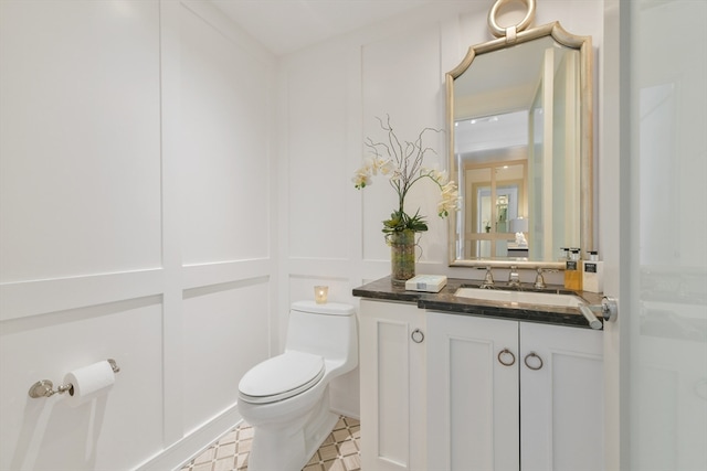 bathroom with vanity and toilet