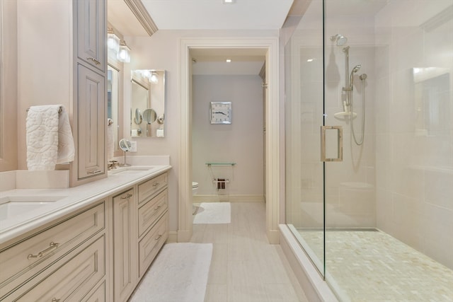 bathroom with vanity, toilet, and an enclosed shower