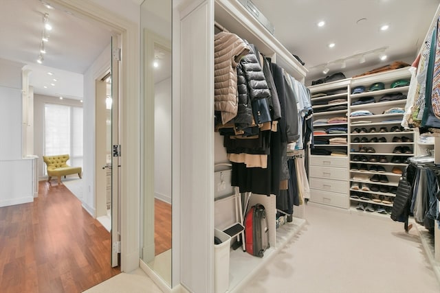 walk in closet featuring light hardwood / wood-style floors