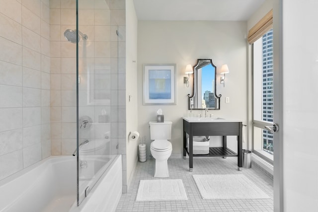 full bathroom with plenty of natural light, tile patterned floors, toilet, and tiled shower / bath combo