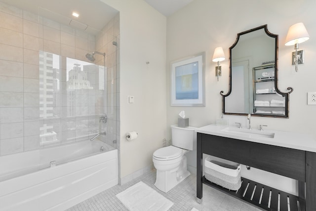 full bathroom with toilet, vanity, tiled shower / bath, and tile patterned flooring