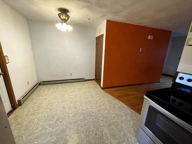 21 Hillside Ave Unit 21, Everett, MA 02149 - kitchen featuring stainless steel electric range, a baseboard heating unit, and ceiling fan
