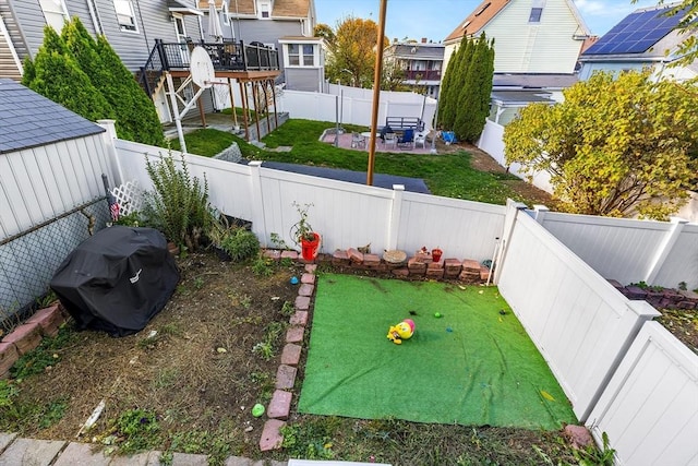 21 Hillside Ave Unit 21, Everett, MA 02149 - fenced backyard featuring a patio area, stairway, and a residential view