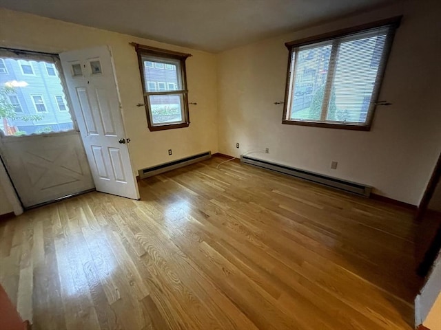 21 Hillside Ave Unit 21, Everett, MA 02149 - entrance foyer with a baseboard radiator and wood finished floors