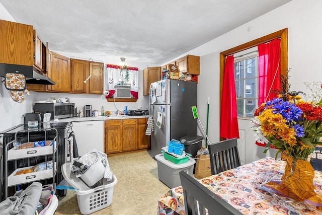 21 Hillside Ave Unit 21, Everett, MA 02149 - kitchen with appliances with stainless steel finishes, brown cabinetry, light countertops, and light floors