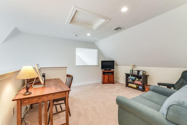 living area with attic access, visible vents, baseboards, light colored carpet, and lofted ceiling