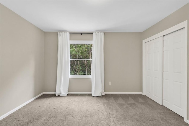 83 Jamestown Dr Unit 83, Springfield, MA 01108 - unfurnished bedroom featuring carpet, baseboards, and a closet