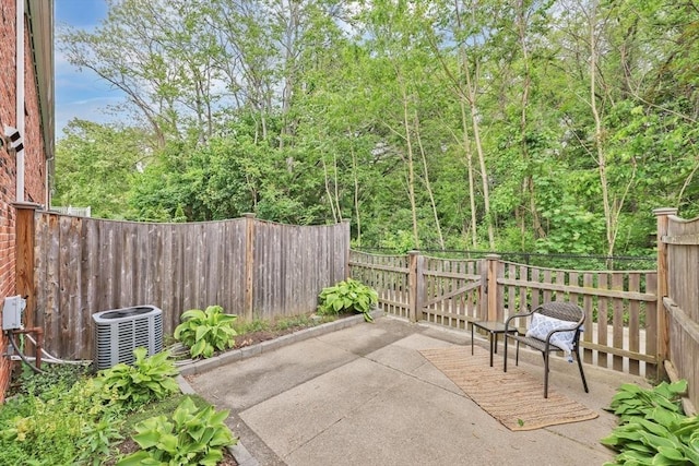 83 Jamestown Dr Unit 83, Springfield, MA 01108 - fenced backyard featuring central air condition unit and a patio