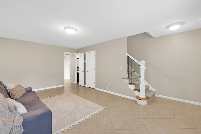 83 Jamestown Dr Unit 83, Springfield, MA 01108 - tiled living area with stairs and baseboards
