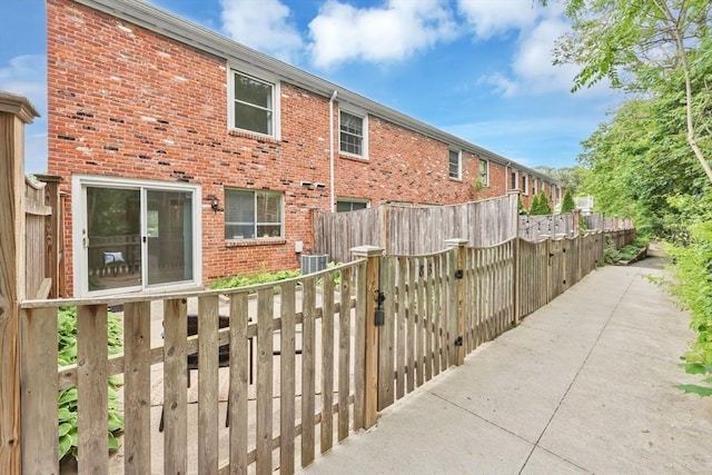 83 Jamestown Dr Unit 83, Springfield, MA 01108 - view of side of property with brick siding and central air condition unit