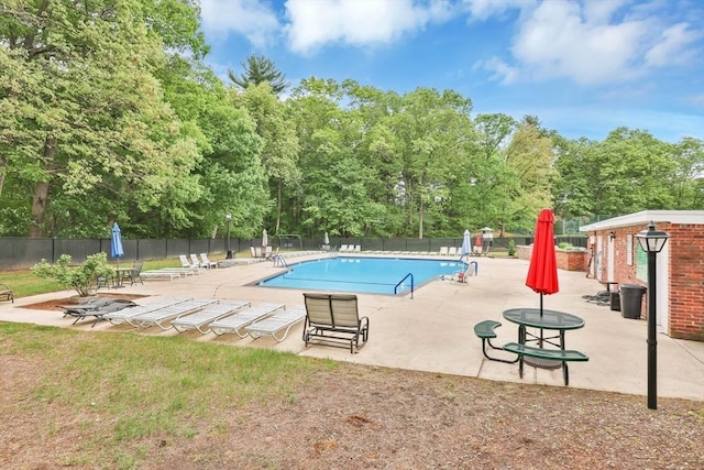 83 Jamestown Dr Unit 83, Springfield, MA 01108 - community pool featuring a patio and view of scattered trees