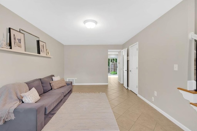 83 Jamestown Dr Unit 83, Springfield, MA 01108 - living room with light tile patterned floors and baseboards