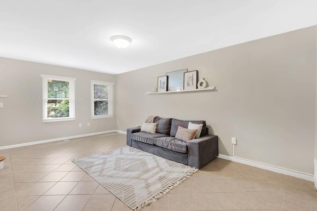 83 Jamestown Dr Unit 83, Springfield, MA 01108 - living room featuring light tile patterned floors and baseboards