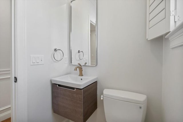 bathroom with toilet and vanity