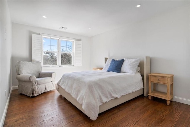 bedroom featuring baseboards, visible vents, dark wood-style flooring, and recessed lighting