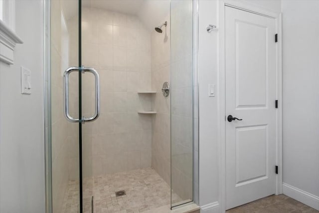 bathroom with a shower stall