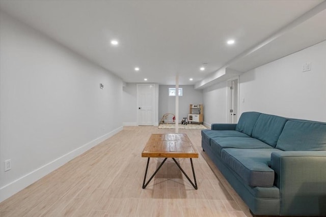 living room featuring recessed lighting, light wood-type flooring, and baseboards